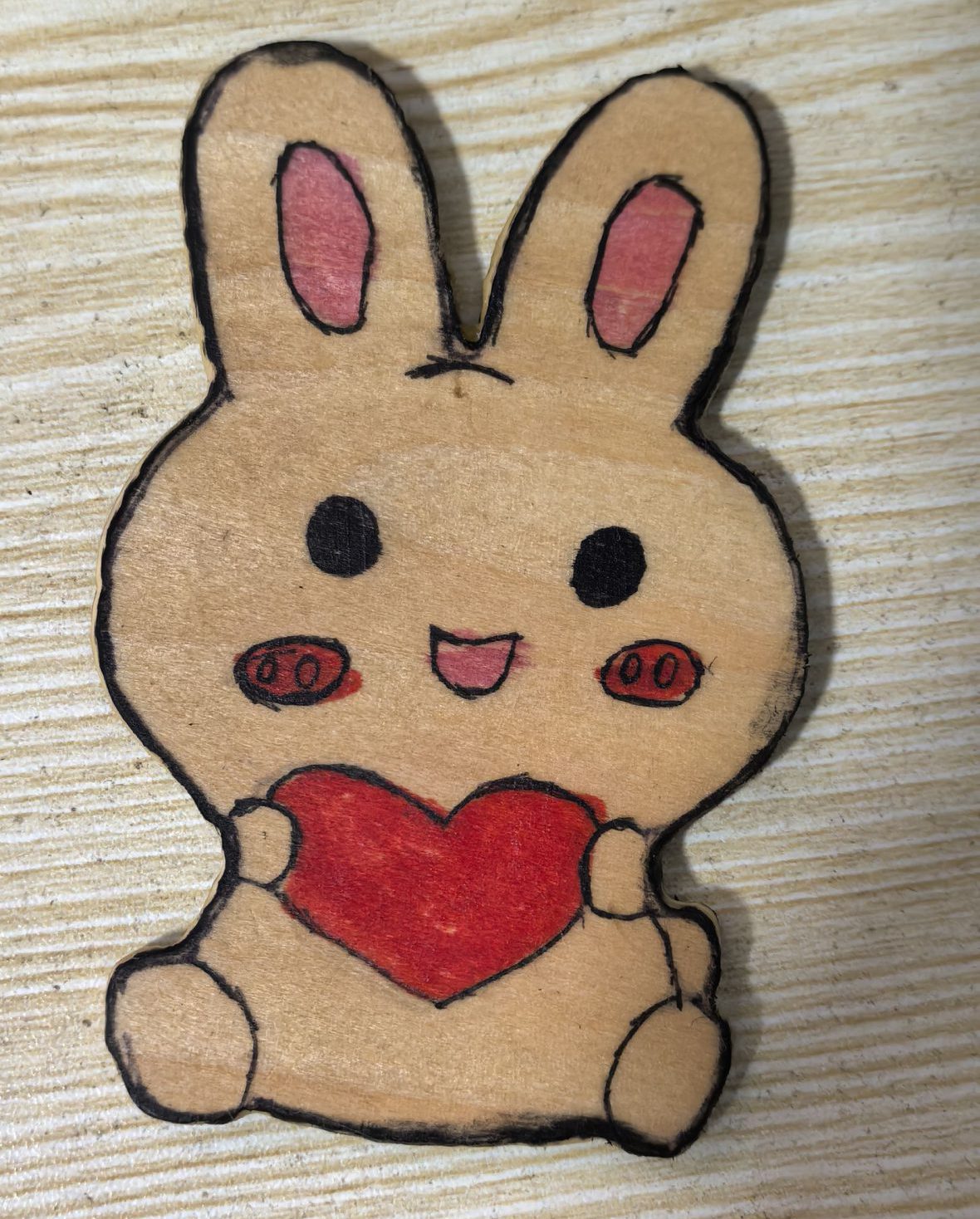 A rabbit card made of wooden boards
